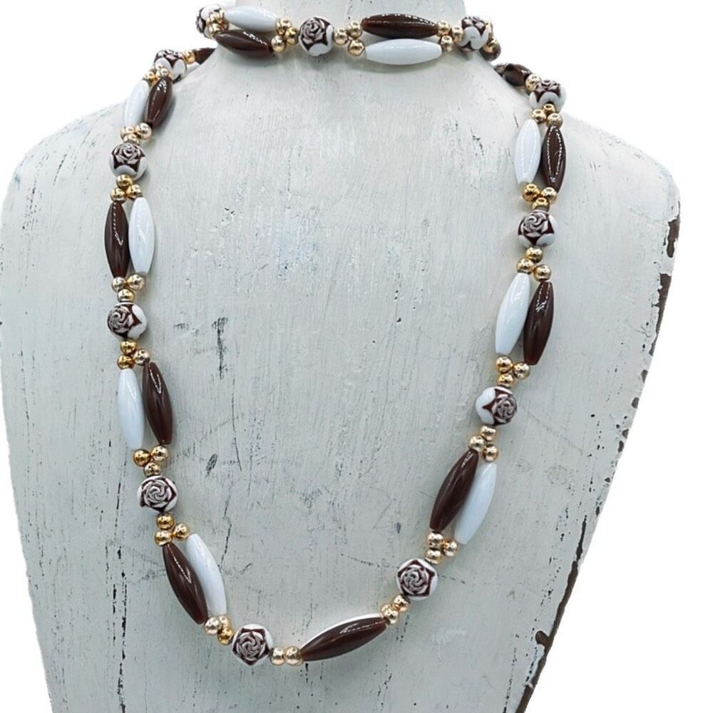 Vintage Germany 26” long brown and white necklace.